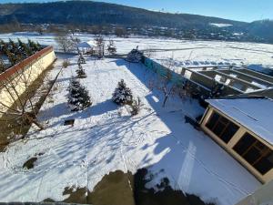 an aerial view of a snow covered roof of a building at Qusar Villa in Uzunmeşǝ