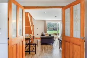 a living room with a couch and a table at 3 Bed in Littledean oc-g31084 in Little Dean