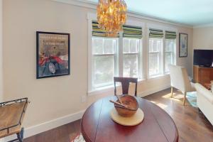 a living room with a table with a bowl on it at Steps to Riverfront: Dtwn Bluffton Studio! in Bluffton +4 photos