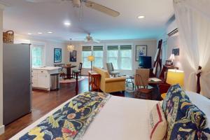 a room with a bed and a kitchen and a living room at Steps to Riverfront: Dtwn Bluffton Studio! in Bluffton