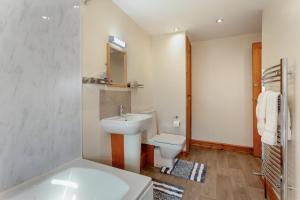 a bathroom with a sink and a toilet at 3 Bed in Littledean oc-g31084 in Little Dean +17 photos