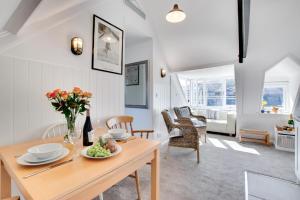 a kitchen and living room with a table and chairs at 1 Bed in St. Ives oc-cp5 in St Ives