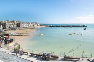 a view of a beach with boats in the water at 1 Bed in St. Ives oc-cp5 in St Ives