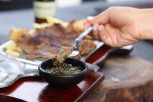 a person eating food from a bowl with a spoon at Desiderata Resort in Guaduas