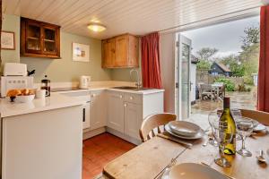 a kitchen with a table and a dining room at 2 Bed in Walberswick oc-h29096 in Walberswick