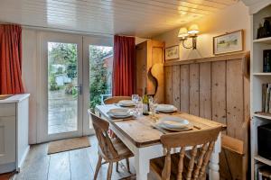 a dining room with a wooden table and chairs at 2 Bed in Walberswick oc-h29096 in Walberswick