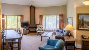 a living room with a couch and a table at Cahilty #429 home in Sun Peaks