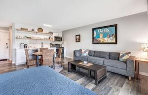 a living room with a couch and a table at Riverfront Studio in Downtown Bend in Bend