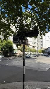 a street sign on the corner of a street at Hotel San Carlos in Mar del Plata