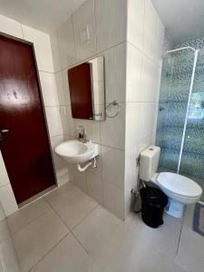 a bathroom with a sink and a toilet at Cantinho 108 in São Luís