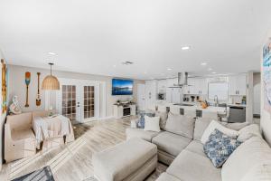a living room with a couch and a kitchen at 332 Formosa Drive in Cocoa Beach