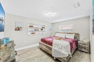 a bedroom with a bed and a window at 332 Formosa Drive in Cocoa Beach