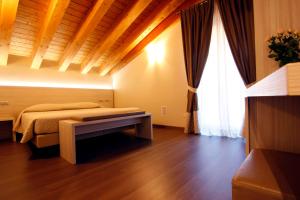 Posteľ alebo postele v izbe v ubytovaní Albergo Del Ponte