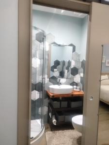 a bathroom with a sink and a toilet at Arthouse in Molfetta