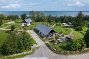 an aerial view of a home with a barn at Taju Resort in Manniva