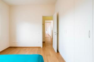 an empty room with a bed and a hallway at Sunset Terrace Sorrento Coast in Sant'Agnello