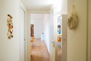 a hallway leading to a dining room and a living room at Sunset Terrace Sorrento Coast in Sant'Agnello +26 photos