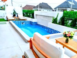 a swimming pool in the backyard of a house at Ifemide Estates - Luxury Homes in Akure