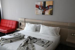 A bed or beds in a room at Hotel A44