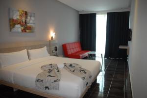 A bed or beds in a room at Hotel A44