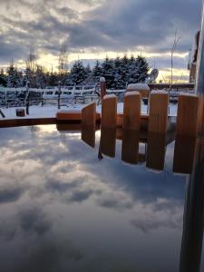 a reflection of the sky in a pool of water at Cabaña Rakin Guilliw in Lonquimay