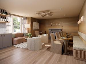 a living room with a couch and chairs and a fireplace at Shore Haven Inn in Falmouth
