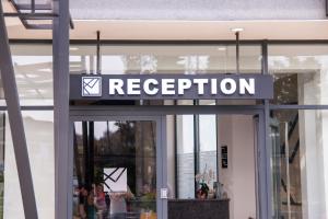 a sign on the door of a store at Hotel Lajka Luxury in Ulcinj +129 photos