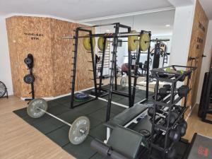 a gym with a bunch of equipment in a room at Hotel Buganvília in Funchal +18 photos