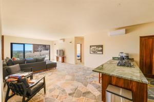 a kitchen and living room with a couch and a table at Casa Arroyo Pacific in Todos Santos