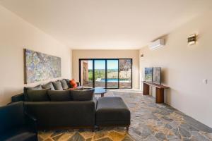 a living room with a couch and a table at Casa Arroyo Pacific in Todos Santos