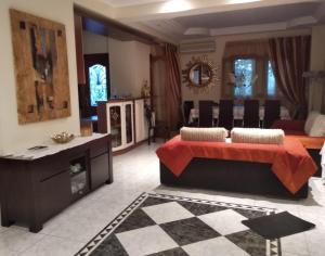 a large living room with a couch and a table at Villa Evi in Volos