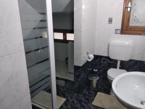 a bathroom with a toilet and a sink at Villa Evi in Volos +50 photos
