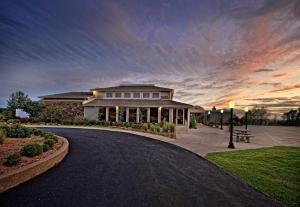 a building with a sunset in the background at Downstream Casino Resort in Loma Linda