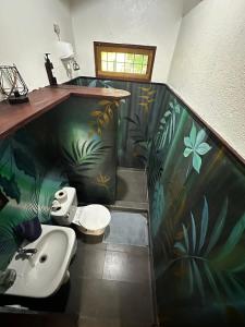 a bathroom with a toilet and a sink at Mono Azul Cahuita in Cahuita +26 photos