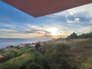 a view of the ocean from a house at Golden Sun Refugio -Calheta in Estreito da Calheta