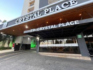 a store front with a sign for a retail place at Crystal Place Flat 509 in Goiânia