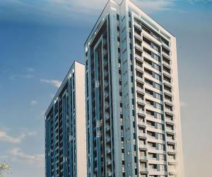 a tall building with many windows on top of it at Skyline Luxury 17th-Floor 1BR near Junction Mall - City Views, Pool, Gym & Full-Body Massage Chair in Nairobi