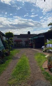 a dirt road in front of a building at Punto Clave in Posadas