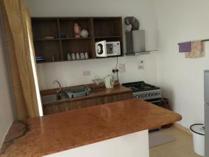 a kitchen with a counter top and a stove at Unity Homes Eldoret in Eldoret