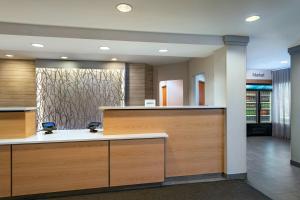 a lobby with a reception desk in a store at Fairfield Inn & Suites by Marriott Edison - South Plainfield in Edison