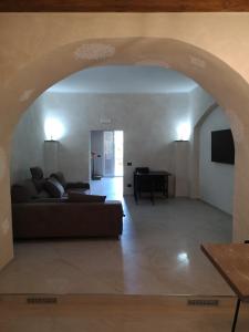 a living room with a couch and a table at Bed and relax in Serre
