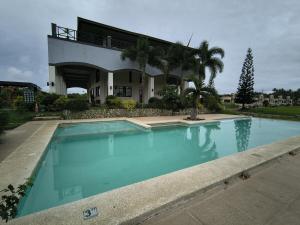 a large swimming pool in front of a house at Haven on the Hill near Twin Lakes in Calo