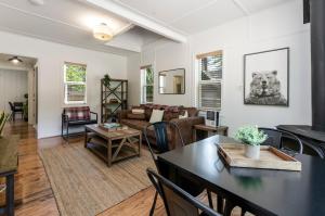 a living room with a table and a couch at Firelite Lodge in Tahoe Vista