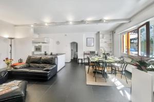 a living room with a couch and a table at Menaggio 57 in Menaggio