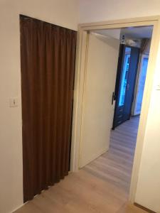 an open door to a room with a brown curtain at Appartement Studio 2 Punat Insel Krk in Punat +26 photos