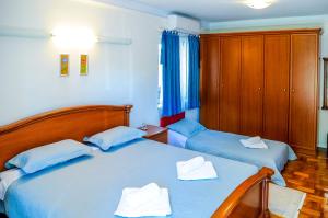 Postel nebo postele na pokoji v ubytování Room and Apartment Perlica