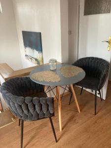a table and two chairs in a living room at Willa Zakopane Center in Zakopane