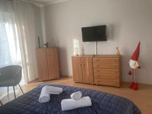 a bedroom with a santa hat and a bed with towels at Willa Zakopane Center in Zakopane