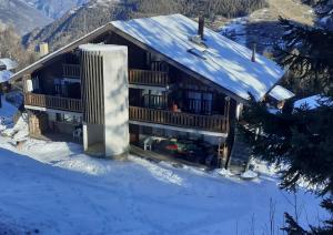 an aerial view of a house in the snow at Mountain Studio in La Tzoumaz