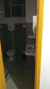 a bathroom with a toilet and a sink at Marlon Franca in Salvador